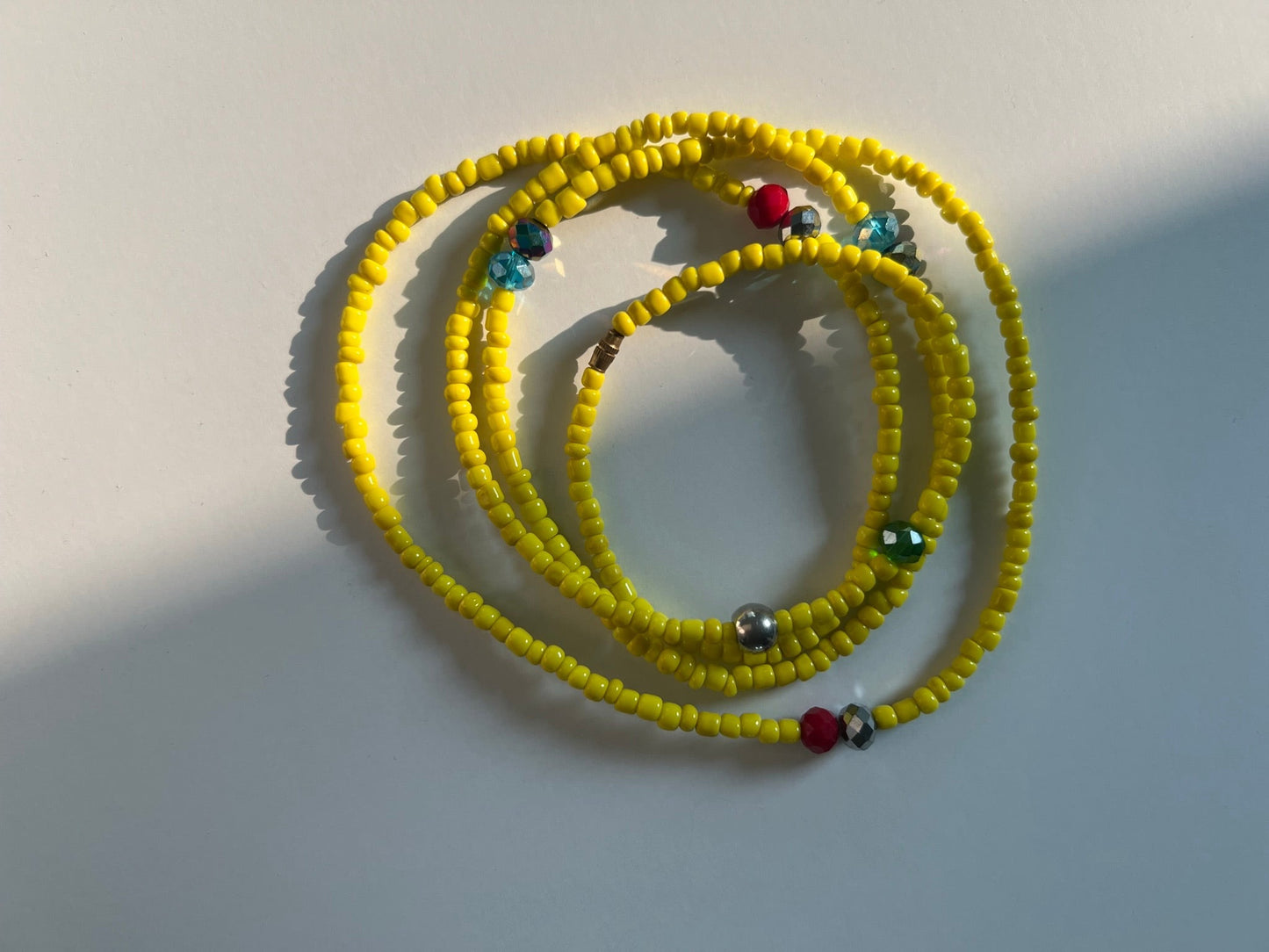 yellow waist bead with accent beads